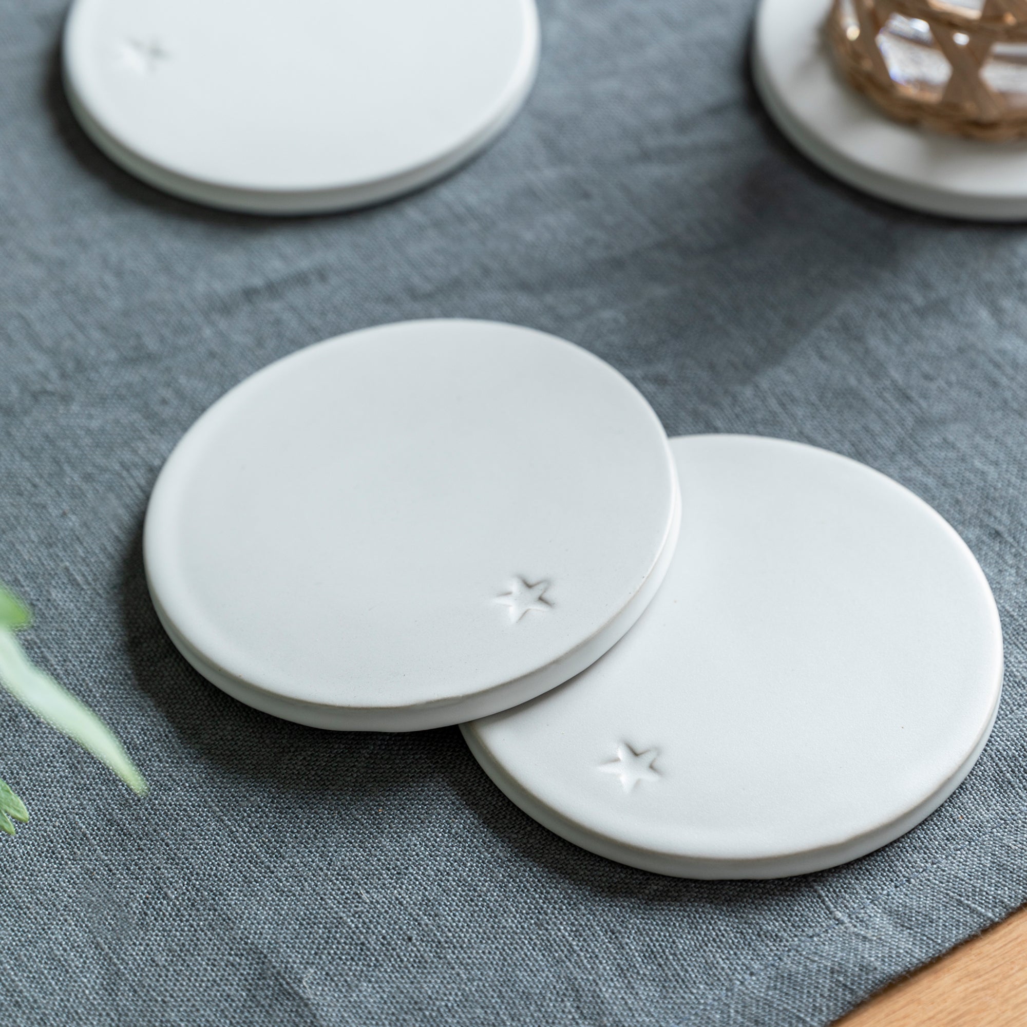 Set of 4 Ceramic Coasters with Debossed Star