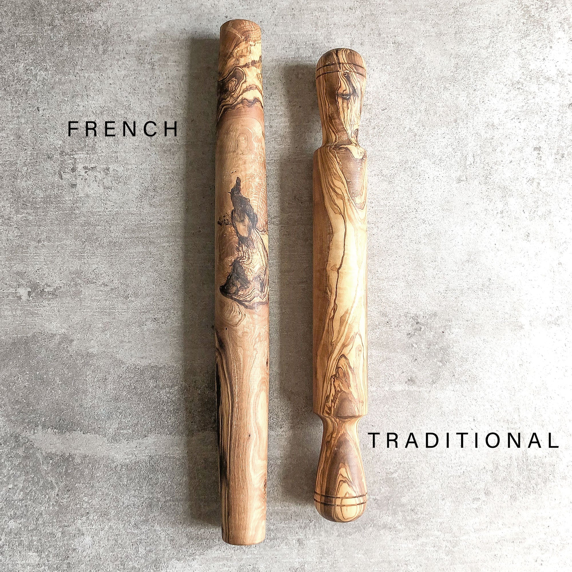 two olive wood rolling pins side-by-side on a light grey surface showcasing the variation between a french style rolling pin and a traditional rolling pin.