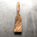 wooden spatula on a grey surface